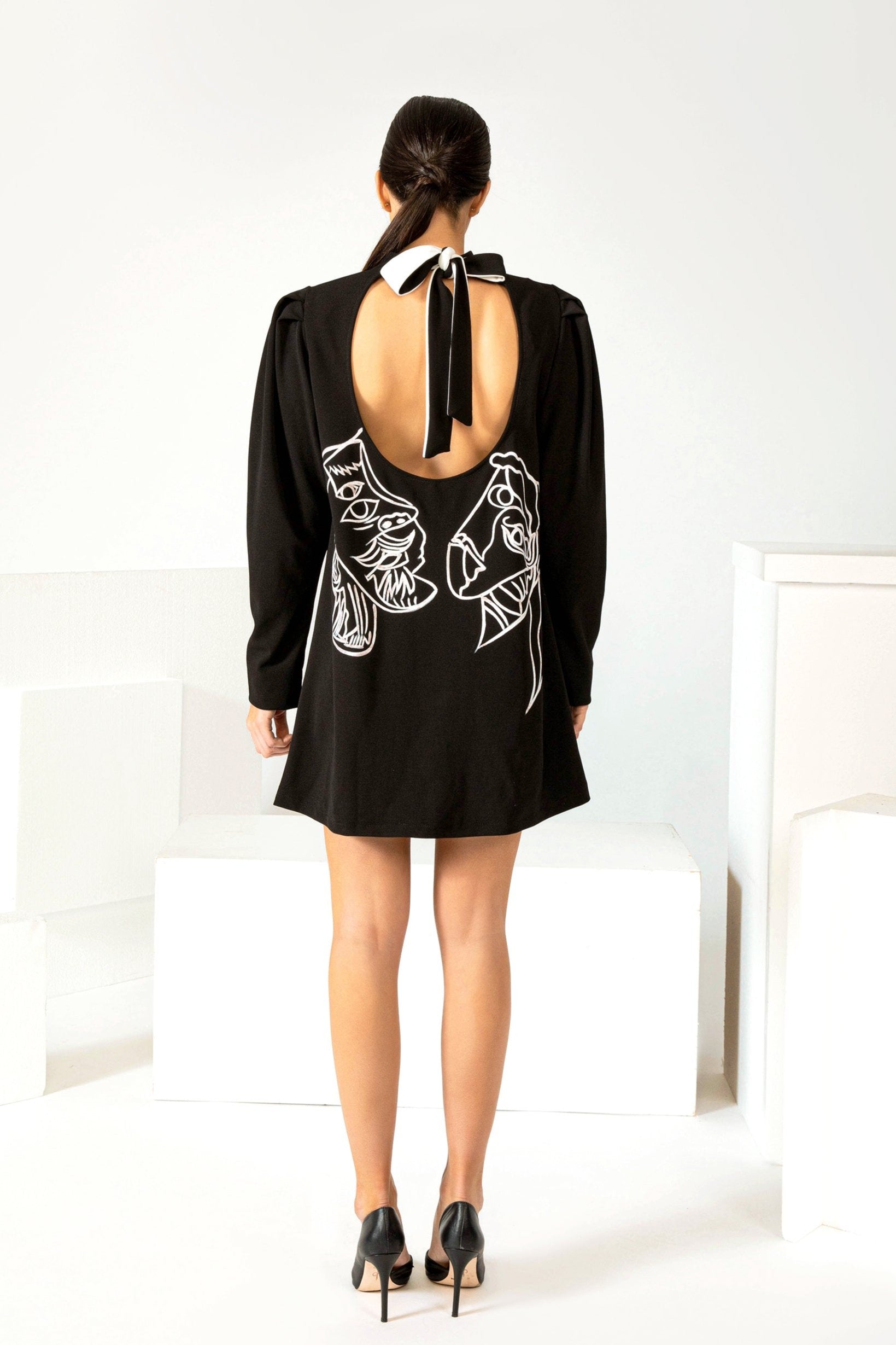 Women hand painted high neck black queen mini dress on mannequin