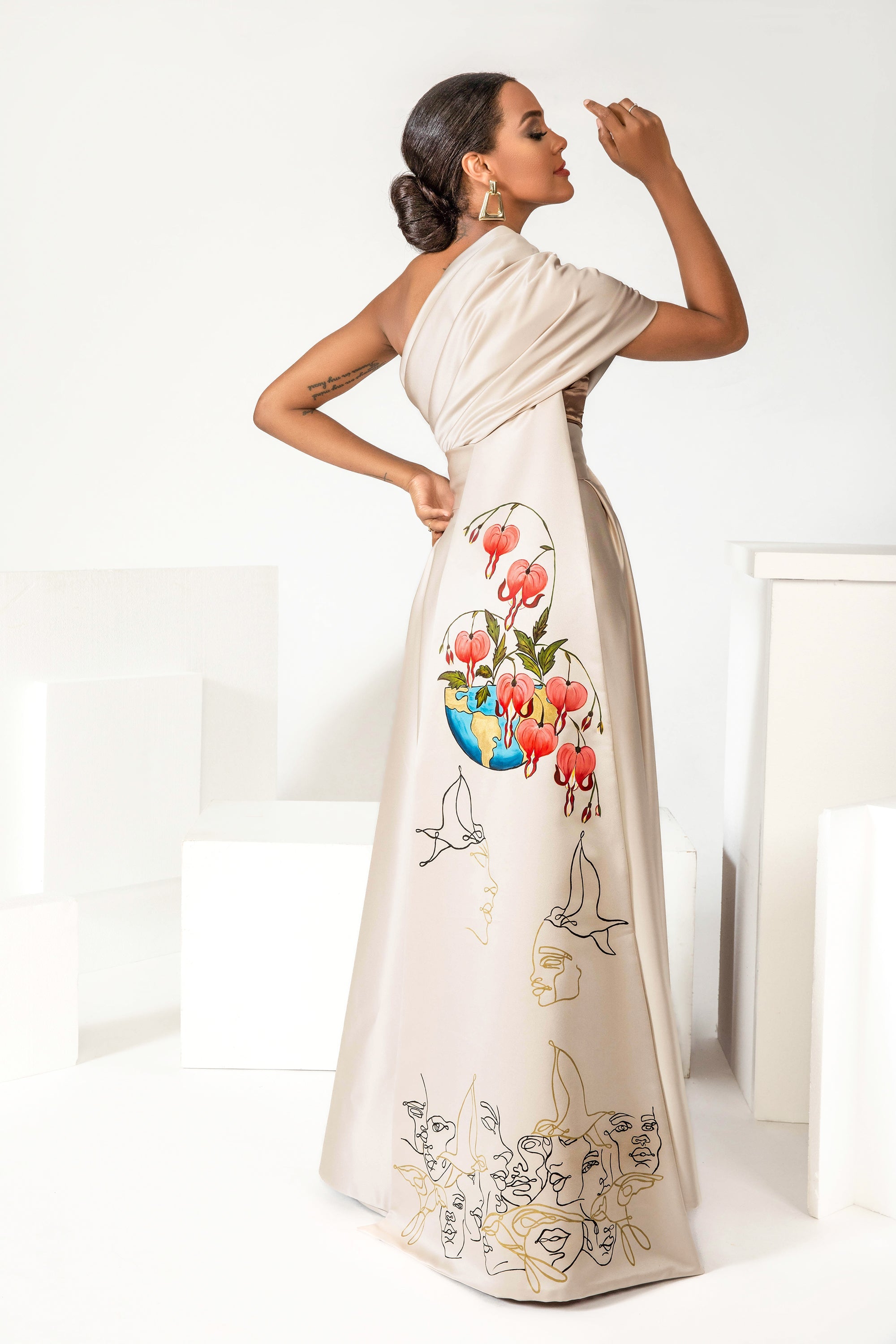 Hand-painted Bleeding Hearts in Peace one-shoulder silk satin gown with removable train handcrafted in LA studio