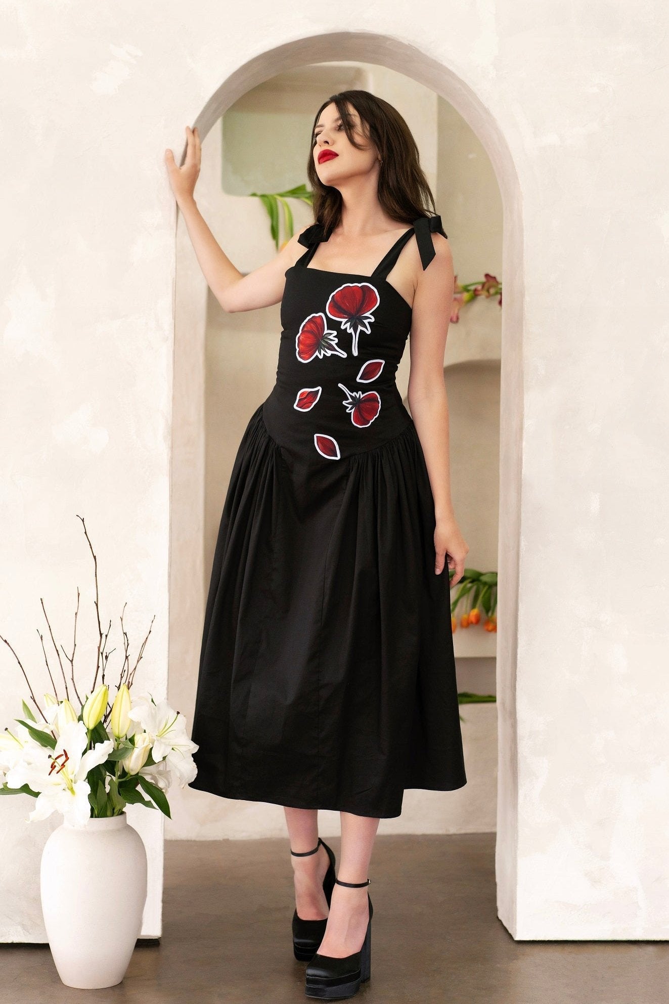 Women wearing Peace Blossoms Elegant Floral Midi Dress with hand-painted red flowers on black cotton twill fabric