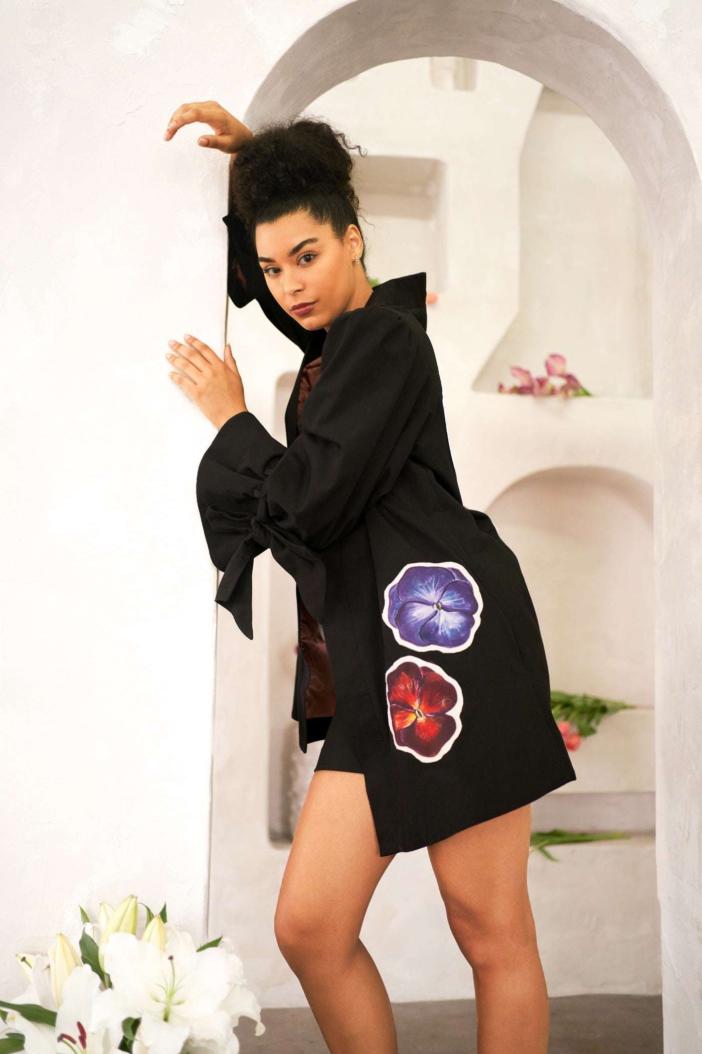 Women wearing Capricorn zodiac jacket with hand-painted astrological patchwork and cotton twill fabric