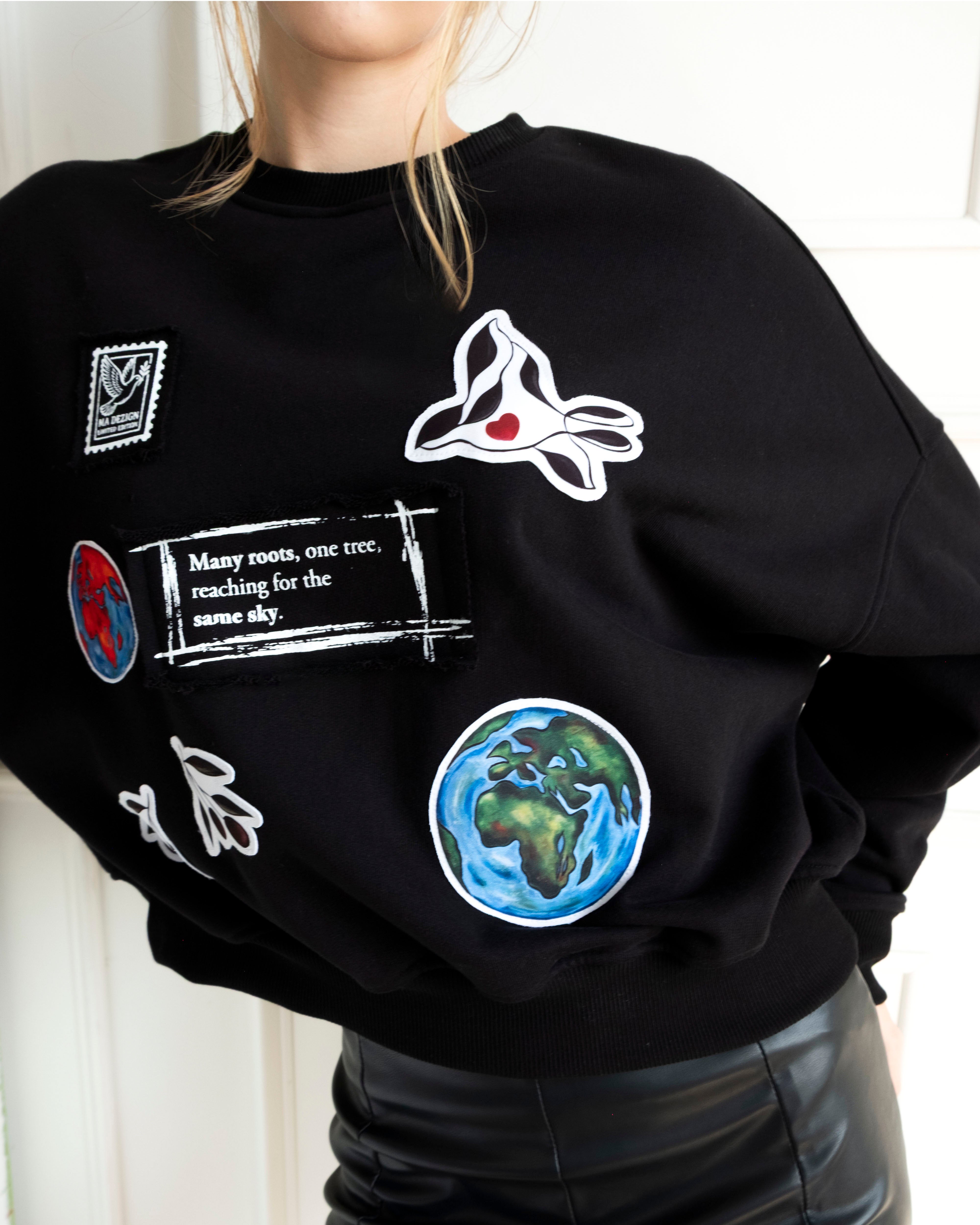 Unity World Cropped Crewneck with peace-themed patchwork and Earth motifs on 100% cotton French terry