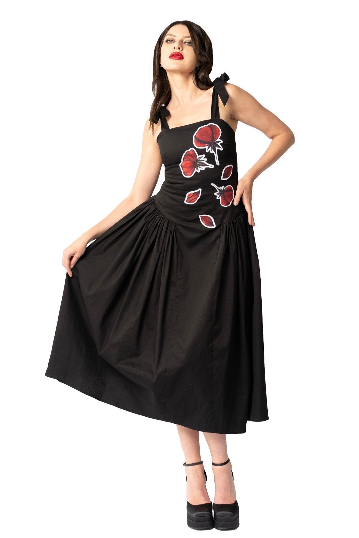 Women wearing Women Midi Dress- Peace Blossoms Elegant Floral Dress black cotton twill midi dress with vibrant red floral hand-painted prints and gathered side skirt