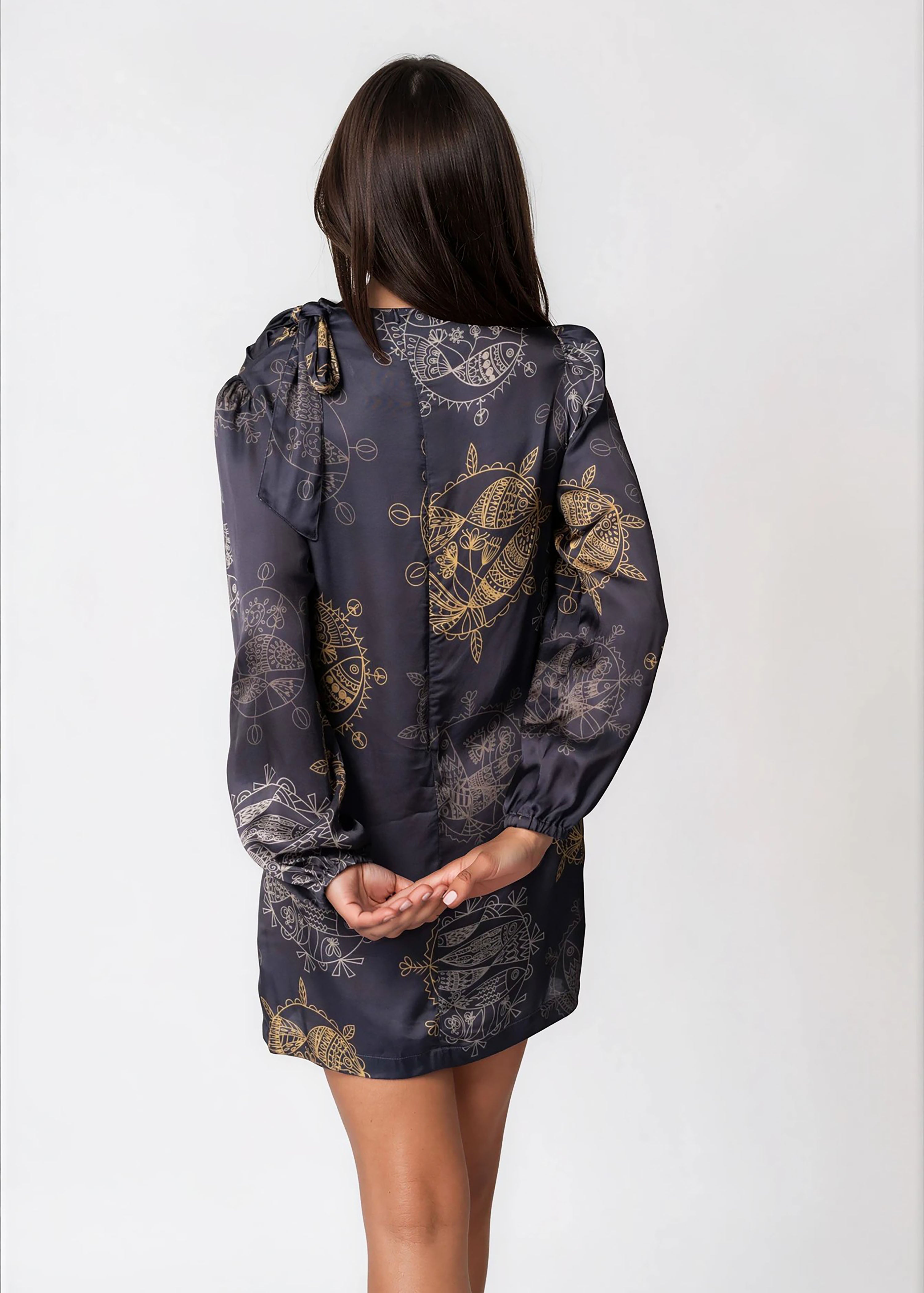 Women wearing Twilight Ocean Dream high neck mini dress with long bell sleeves and self-tie neck detail