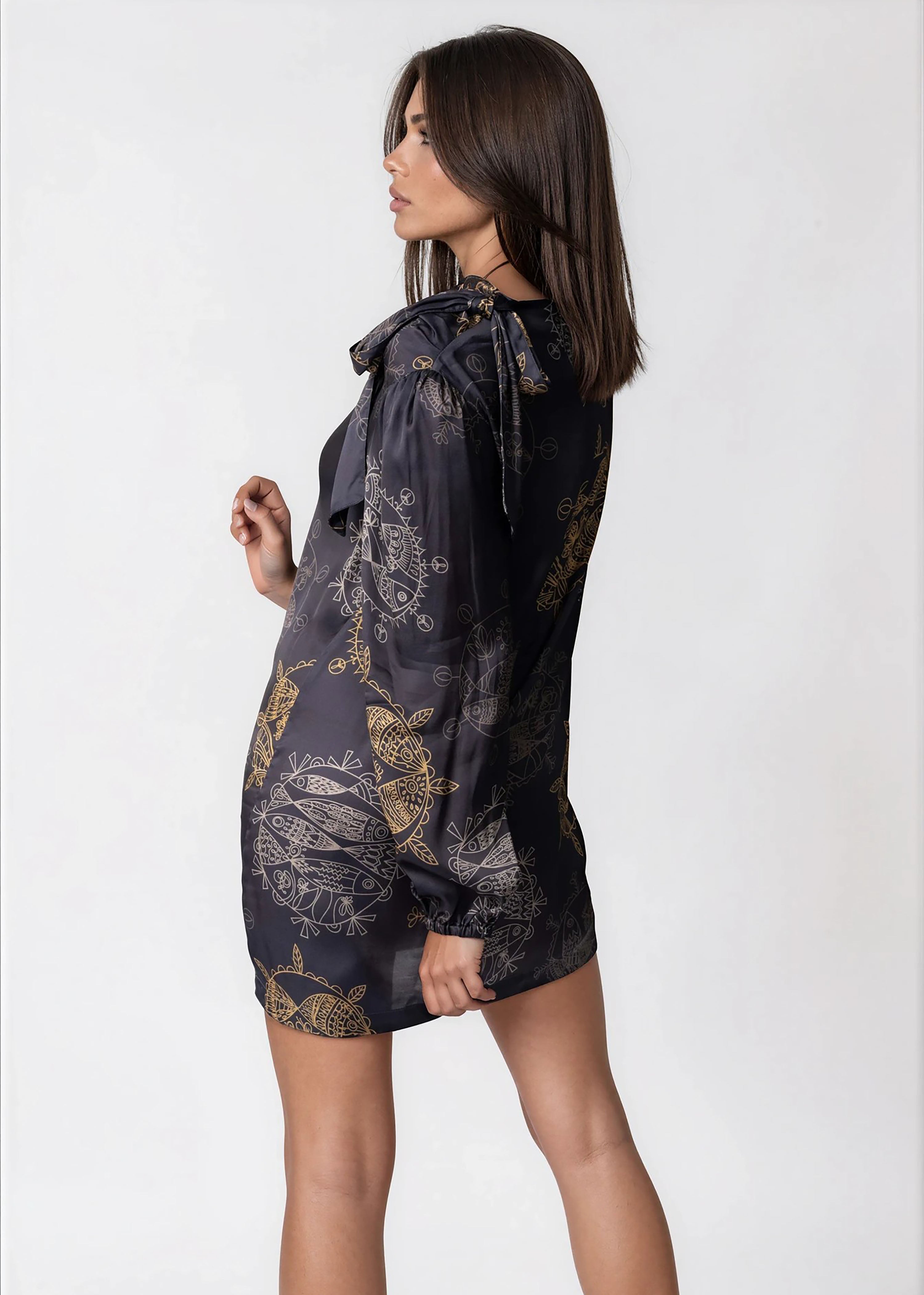 Women wearing Twilight Ocean Dream high neck mini dress with long bell sleeves and self-tie neck detail