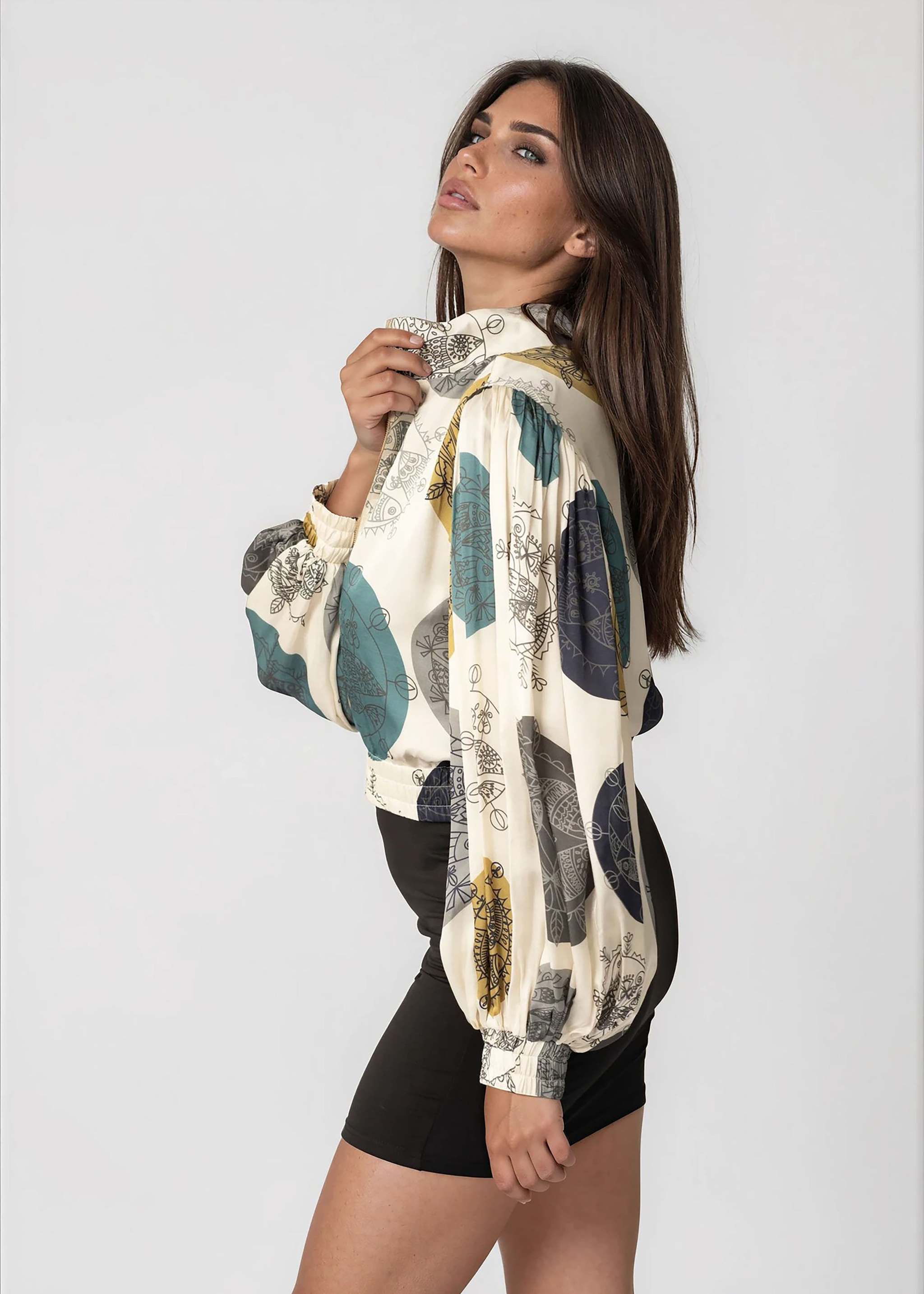 Woman wearing daylight ocean dream cropped bomber jacket with oversized gathered bell sleeves and front zipper