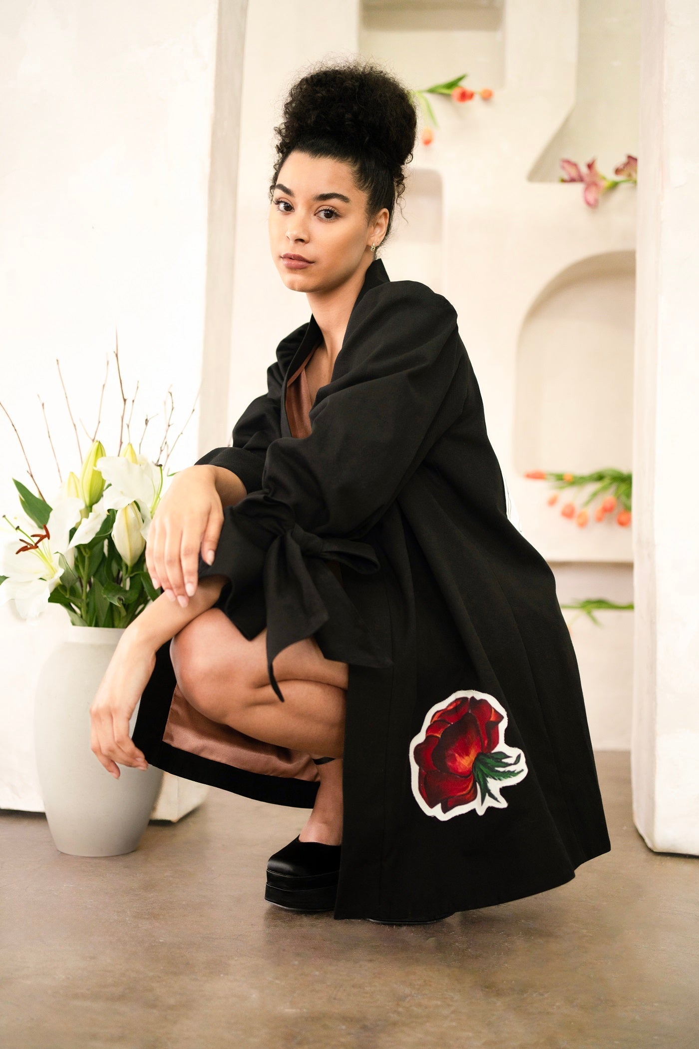 Women wearing a Women Libra Zodiac Jacket with hand-painted astrology symbols on a flared cotton twill swing coat
