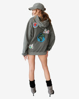 Peace World Patchwork Hoodie with Earth and bird motifs symbolizing unity, made of 100% cotton French terry, designed in Los Angeles.