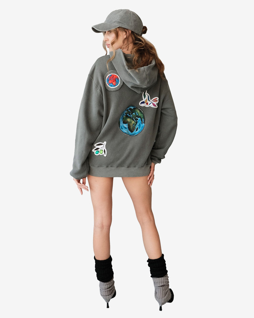 Peace World Patchwork Hoodie with Earth and bird motifs symbolizing unity, made of 100% cotton French terry, designed in Los Angeles.