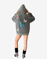 Peace World Patchwork Hoodie with Earth and bird motifs, made of 100% cotton French terry, featuring a relaxed silhouette and peace-themed patchwork design.