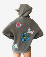 Peace World Patchwork Hoodie with Earth and bird motifs, relaxed silhouette, 100% cotton French terry, designed in Los Angeles, limited edition