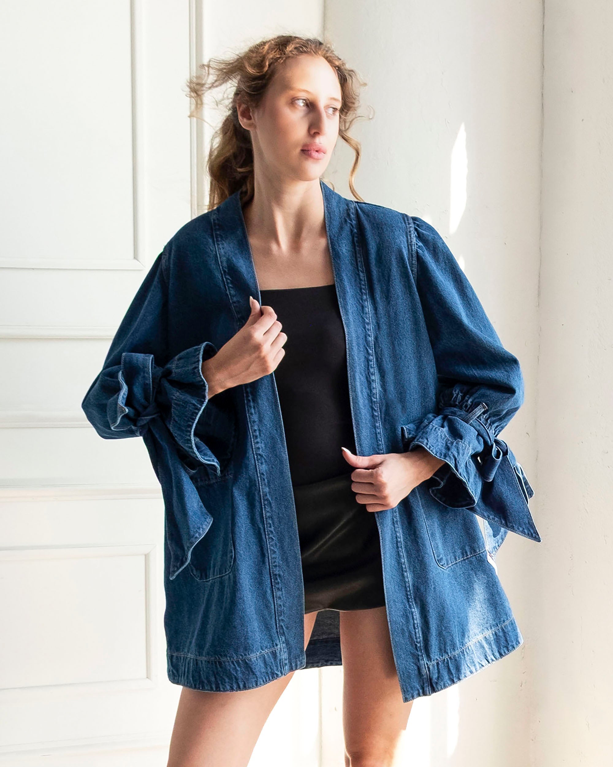 Indigo Atelier Flare Denim Jacket with flared silhouette, patchwork details, voluminous sleeves, and front pockets.