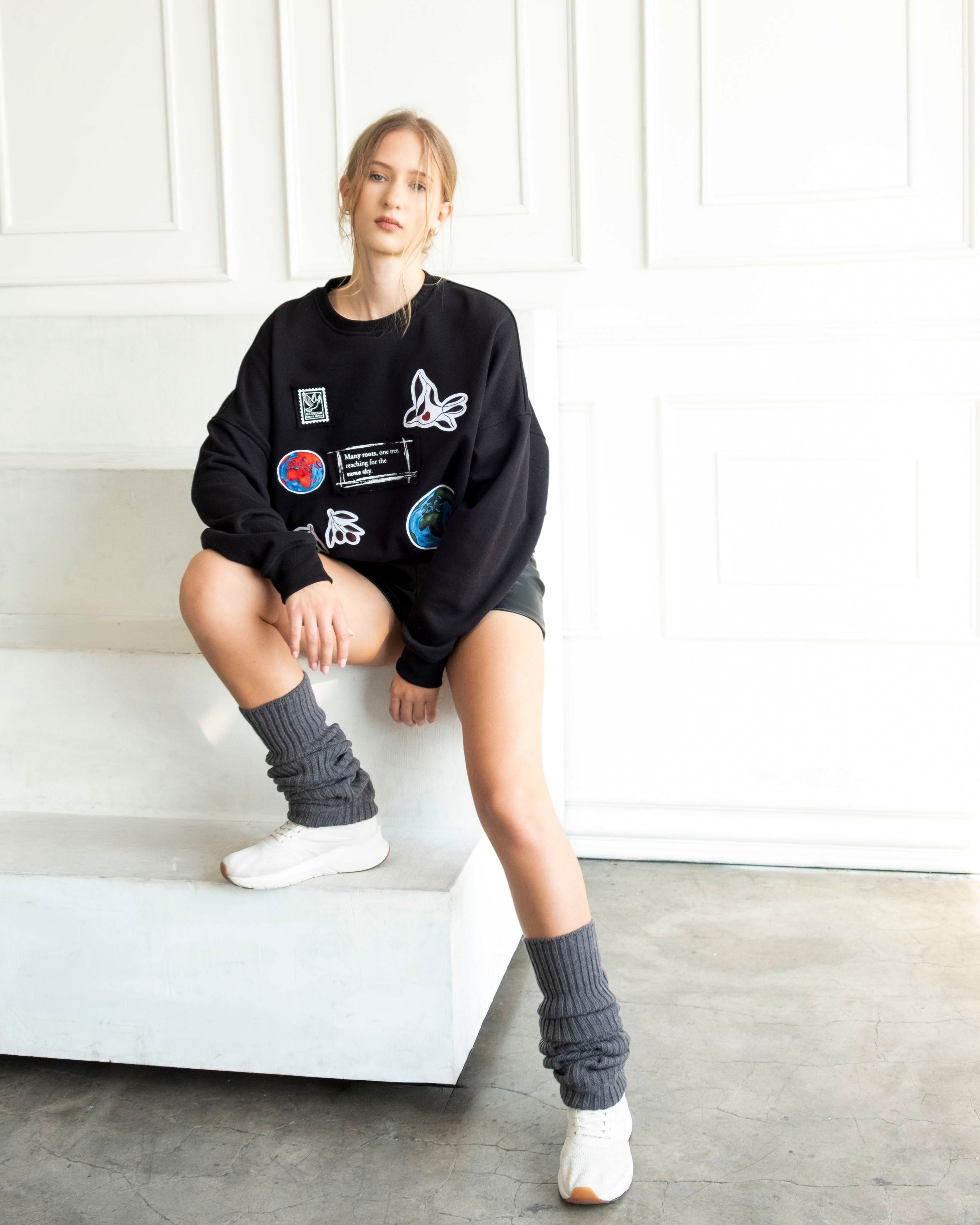 Unity World Cropped Crewneck featuring peace-themed patchwork and symbolic Earth motifs on soft 100% cotton French terry