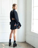 Gray Atelier Flare Denim Jacket with flared silhouette, patchwork, and voluminous sleeves made from 100% washed cotton denim