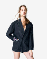 Nomad oversized gray denim jacket with artistic patchwork and open-front design