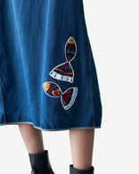 Longline sleeveless indigo denim vest with artistic patchwork and open front design by MA DEZIGN, made in Los Angeles