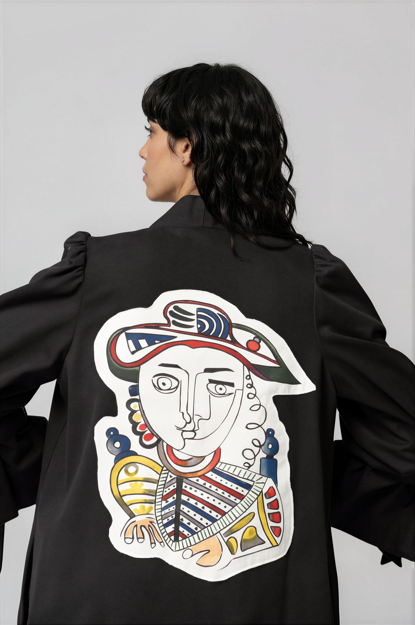 Woman wearing Picasso Masterpiece The King Jacket with hand-painted patchwork and vibrant colors
