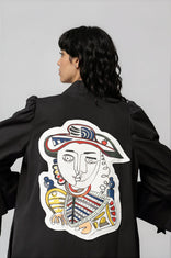 Woman wearing Picasso Masterpiece The King Jacket with hand-painted patchwork and vibrant colors