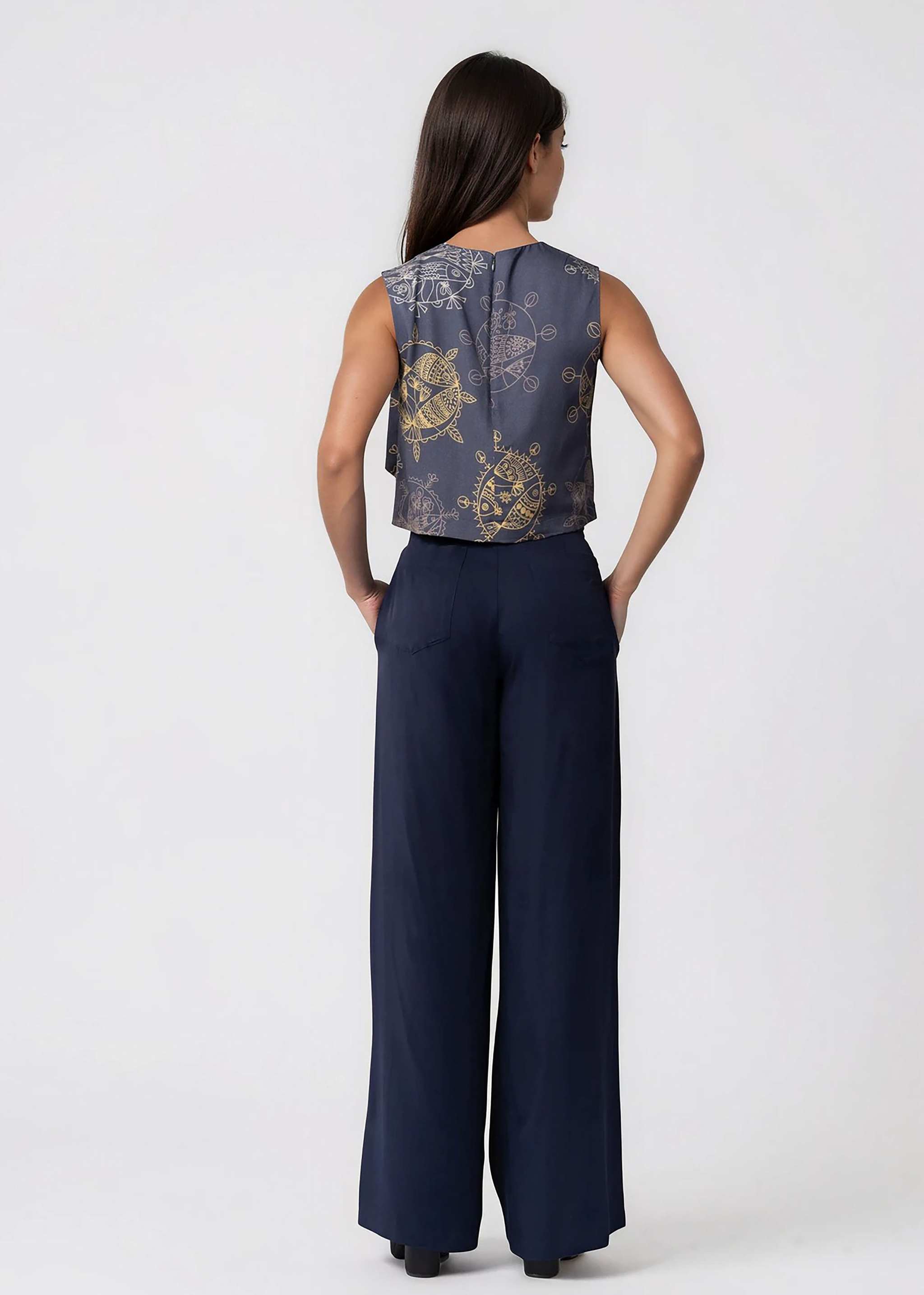 Black high-waisted wide leg pants with pleated front and self-tie belt made from lightweight twill fabric