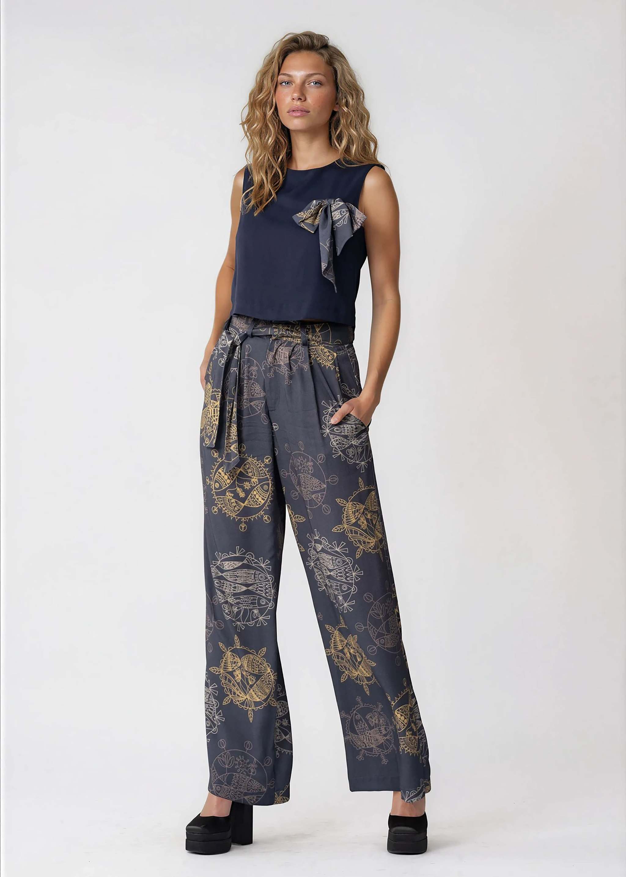 High-waisted wide leg pants in midnight ocean print with self-tie waistband and pleated front