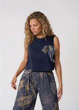 Women's cropped sleeveless bowtie top in midnight blue with round neckline and relaxed fit