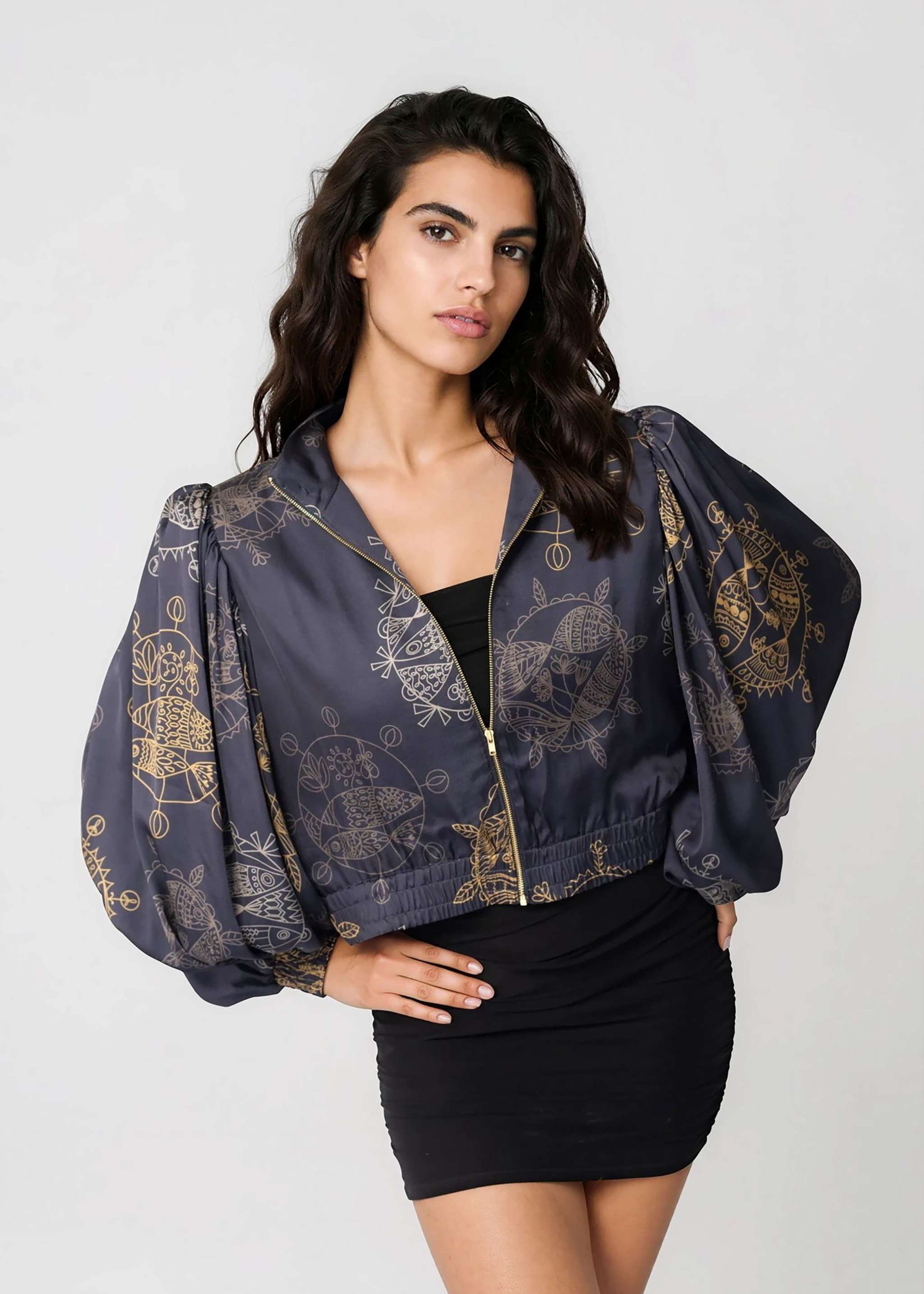 Woman wearing a Twilight Ocean Dream cropped bomber jacket with oversized gathered bell sleeves and front zipper