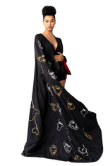 Model wearing IInvisible Government Asymmetric Cape and Pants with hand-painted world map design