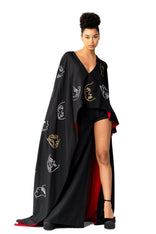 Model wearing Invisible Government asymmetric silk wool cape and one-leg pants with hand-painted world map design