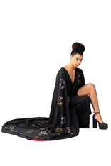 Hand-painted Invisible Government asymmetric cape and one-leg pants outfit showcasing global unity and hidden power.