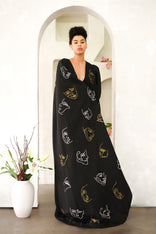 Model wearing Invisible Government asymmetric hand-painted cape and one-leg pants set