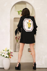 Woman wearing a Women Leo Zodiac Jacket with hand-painted Leo zodiac symbols and constellation patches