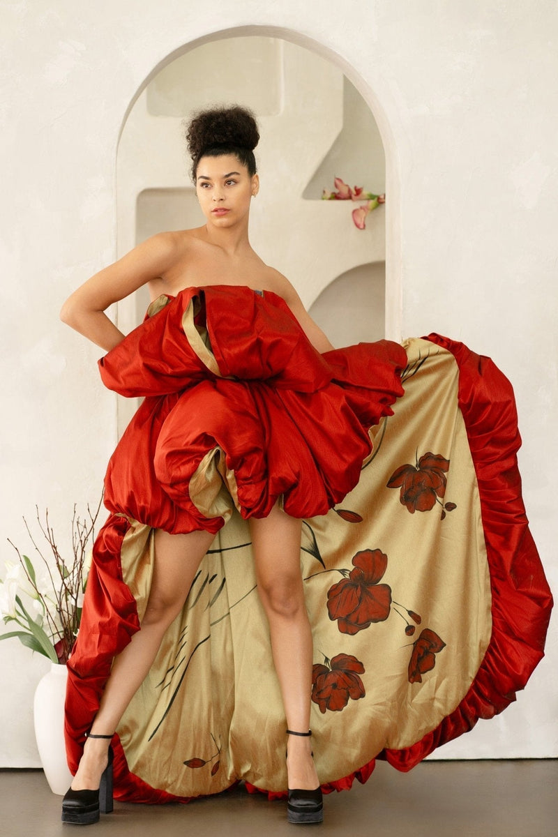 Red peony ruffled asymmetric gown with hand-painted birds and puff skirt on model