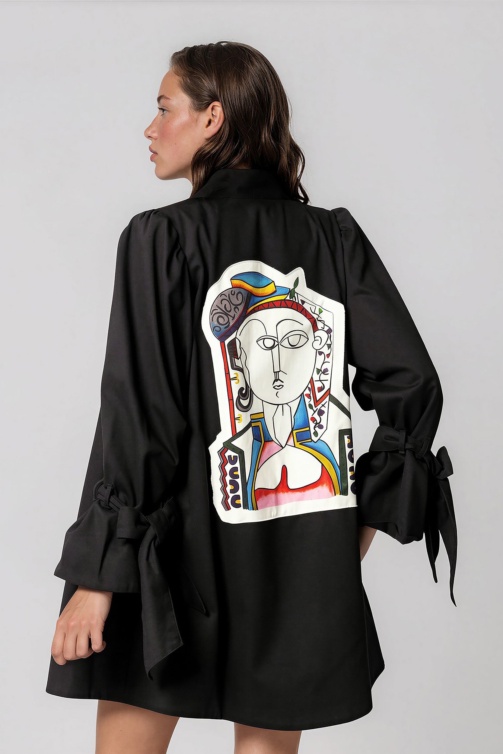 Woman wearing Picasso The Queen Masterpiece Jacket with vibrant hand-painted patchwork design