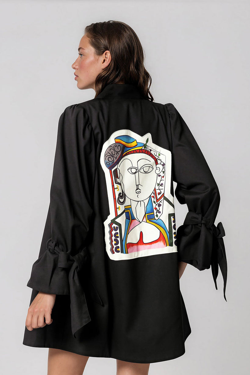 Woman wearing Picasso The Queen Masterpiece Jacket with vibrant hand-painted patchwork design