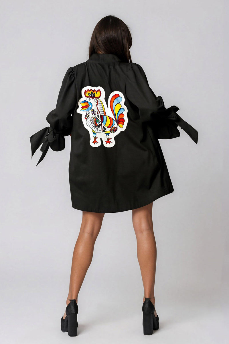 Woman wearing Picasso Masterpiece The Rooster Jacket featuring hand-painted patchwork and vibrant colors