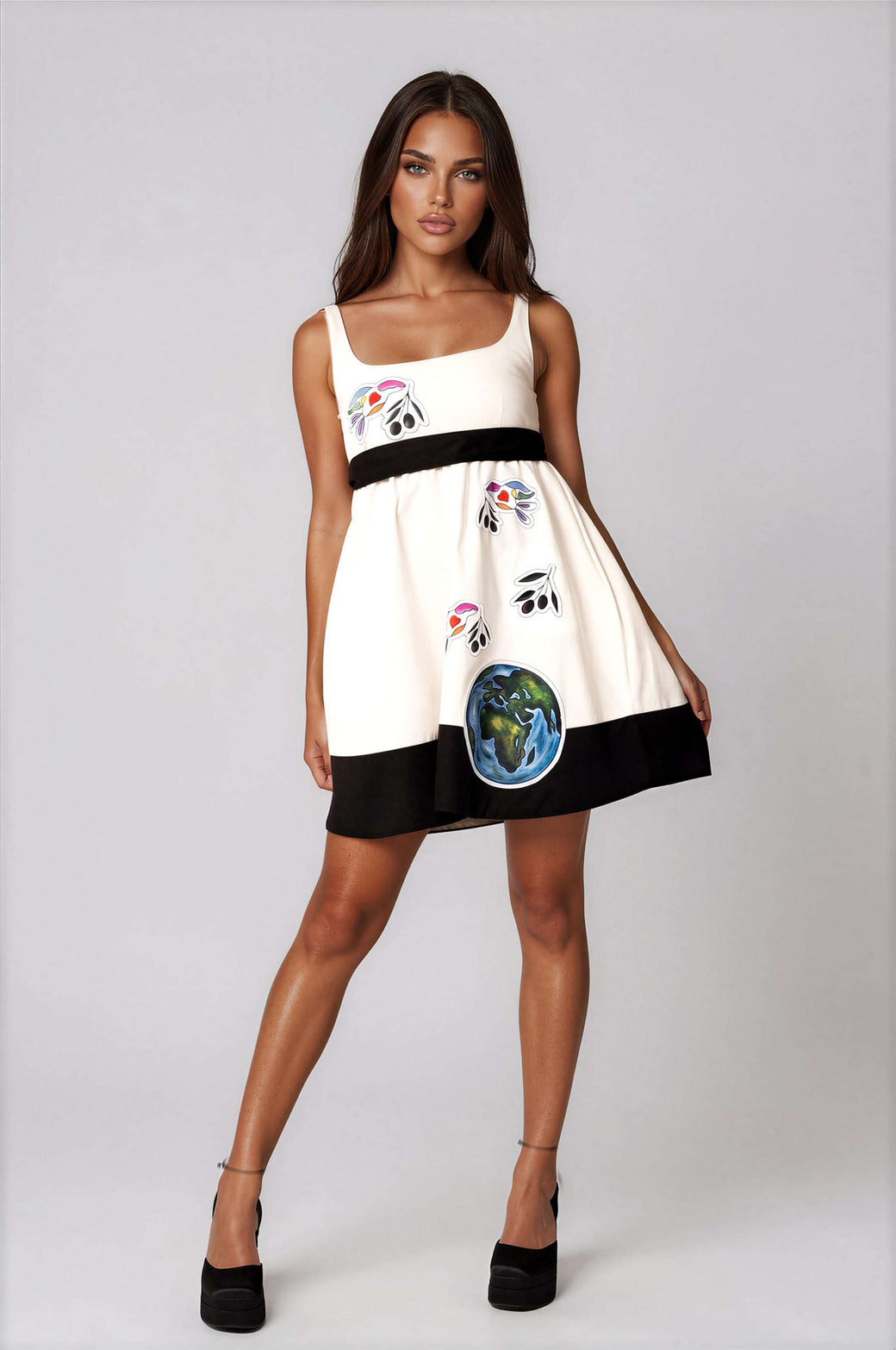 White elegant women's mini dress with peace bird artwork, empire waist, sleeveless, and self-tie belt