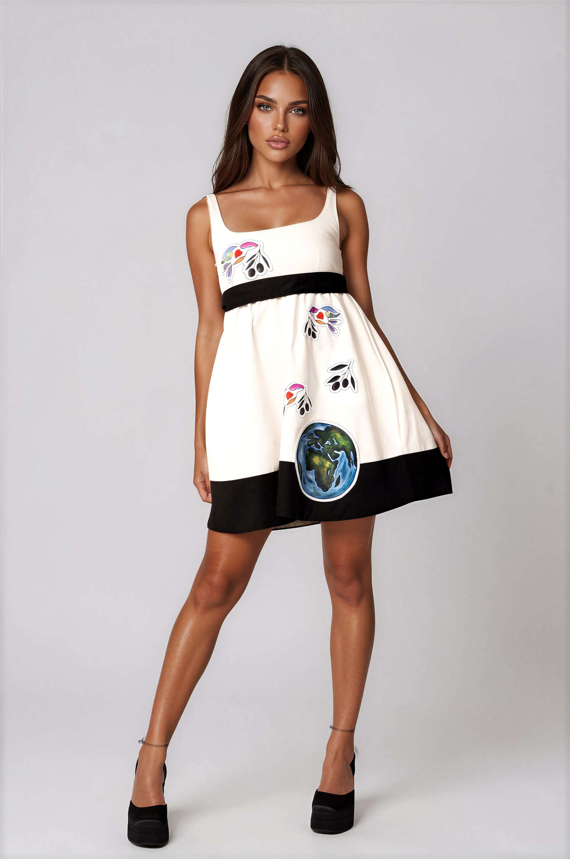 White elegant women's mini dress with peace bird artwork, empire waist, sleeveless, and self-tie belt