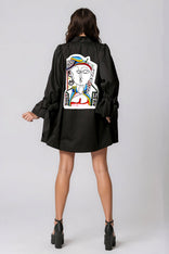 Woman wearing Picasso The Queen Masterpiece Jacket featuring hand-painted Picasso-inspired patchwork design