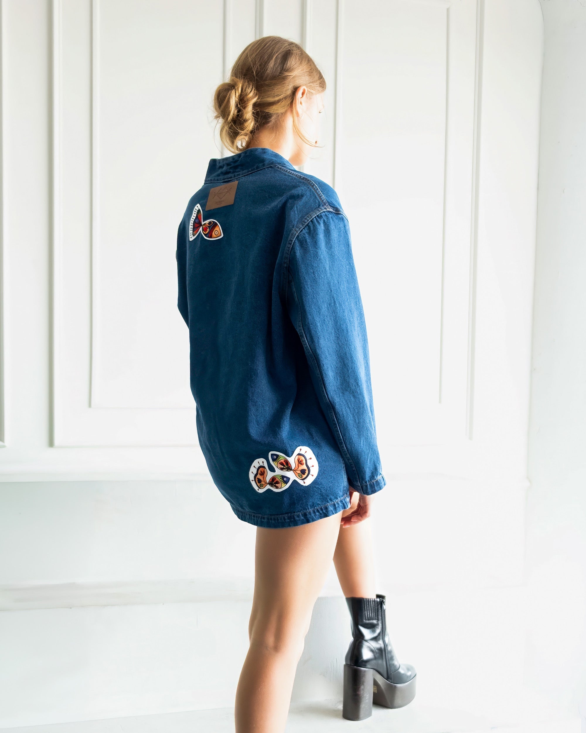 Nomad Oversized Denim Jacket in indigo with artistic patchwork and relaxed fit made from 100% cotton denim