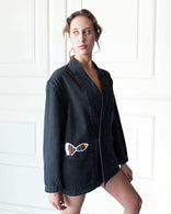 Gray Nomad oversized denim jacket with artistic patchwork and open front design made from 100% cotton in Los Angeles