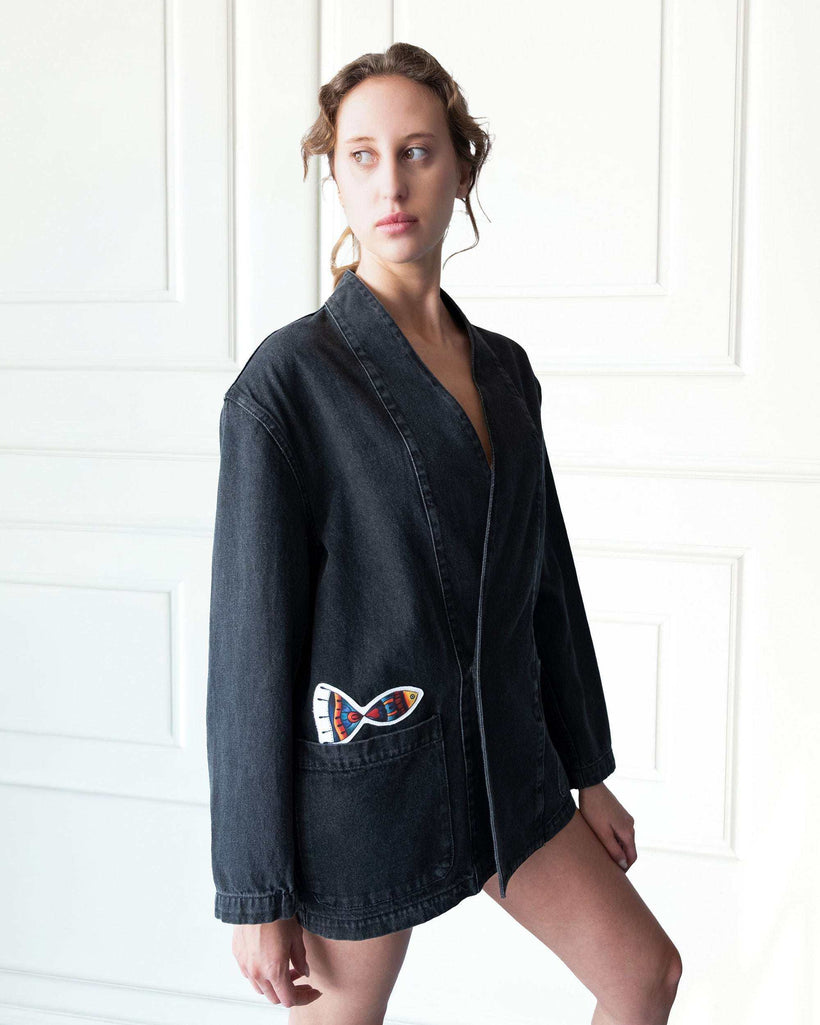 Gray Nomad oversized denim jacket with artistic patchwork and open front design made from 100% cotton in Los Angeles