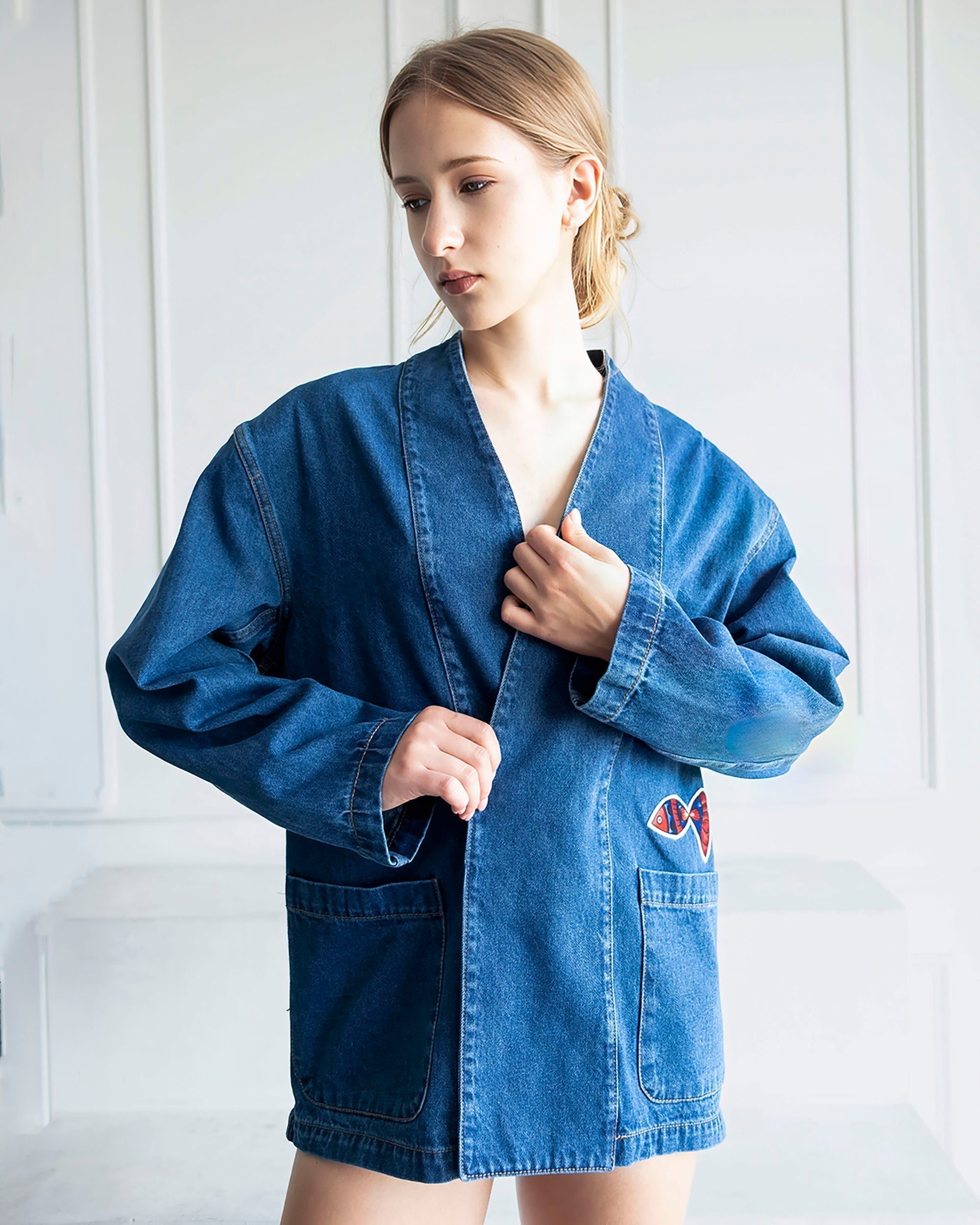 Indigo Nomad Oversized Denim Jacket with artistic patchwork and relaxed open-front design made of 100% cotton denim
